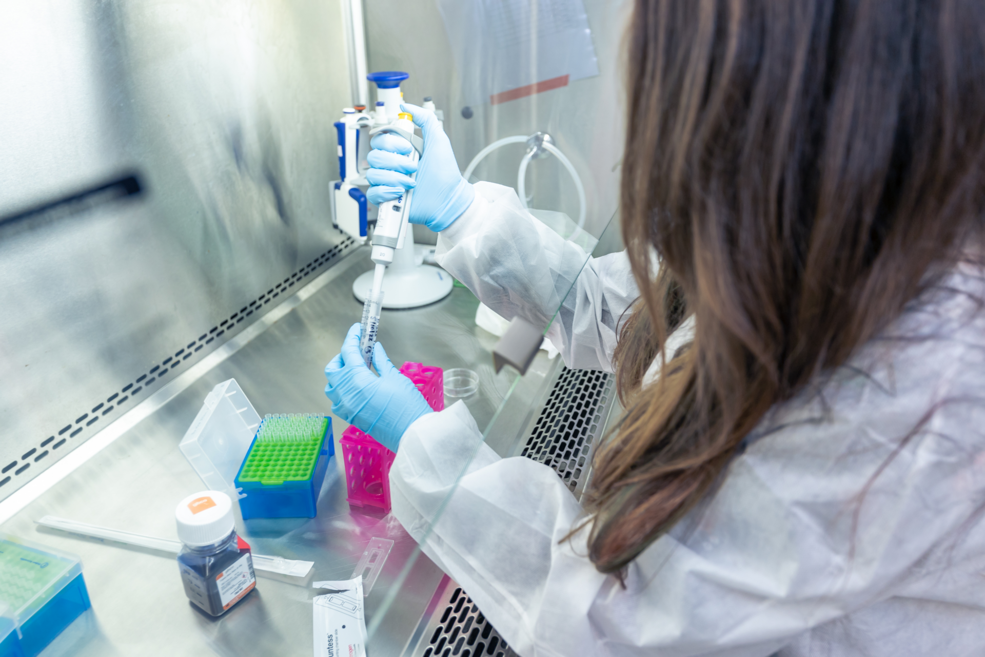 Scientist-pipetting-in-cell microsystems lab